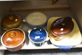 An assortment of casserole dishes and a oven dish, including Denby stoneware.