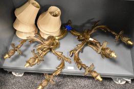 A pair of gilt metal Rococco style three branch wall light fittings