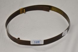 An antique milliners hat measuring device.