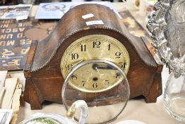 A 1930s hump back mantel clock, AF.