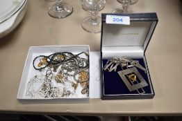A collection of predominantly silver chains, and a Stirling silver necklace with yellow gemstone and