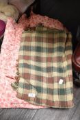A 1960s floral bed throw and an Indian made 100% cotton throw in neutral tones.