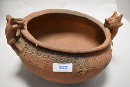 A studio pottery terracotta bowl, having animal studies to sides and impressed border, purchased