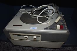 A vintage Philips portable record player.