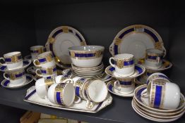 A collection of Alfred Meakin 'Bleu De Roi' table ware, having cobalt blue banding with gilt