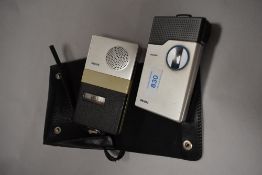 Two retro Philips micro cassette dictation devices.