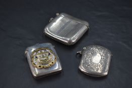 A George V silver vesta case, of hinged and engine-turned rectangular form, marks for Birmingham