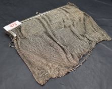 A George V 925 grade white metal mesh purse, the clasp with ball finials over the plain mounts,