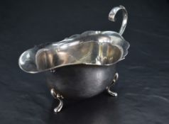 A George V silver gravy boat, of traditional design, Birmingham 1932, maker William Suckling Ltd,
