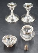 A pair of George V silver squat candlesticks, each moulded with reeded bands, marks for Birmingham