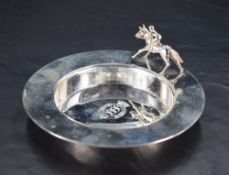 A Queen Elizabeth II silver dish, of circular form, the broad plain rim with racehorse ornament