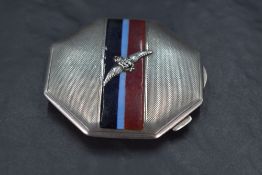 A George VI silver military interest powder compact, of octagonal for, with engine-turned surface