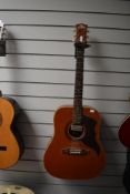 A vintage Eko jumbo acoustic guitar with pickup