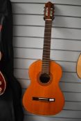 A Spanish classical guitar (no strings) , labelled Antonia Lorca, with hard shell case