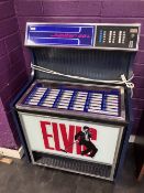 A vintage Juke Box cabinet with working removed and containing Panasonic CD player , lights function