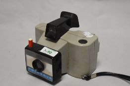 A Polaroid Swinger Sentinal Land Camera