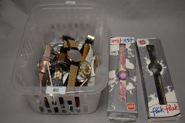 A collection of watches, some new with packaging, including branded items.