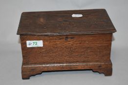 A vintage oak box housing a collection of vintage shoe horns, having advertising for Manchester