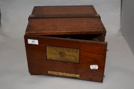 A c.1940 Azimuth Mirror nautical instrument, the black lackered device housed in a mahogany case, by
