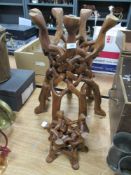 An African hard wood link carved table base and a similar stand.