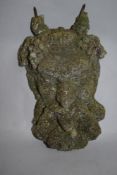 A concrete Bacchus mask, measuring 36cm long