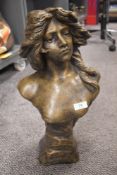 A cast composite bust, having bronze effect finish.