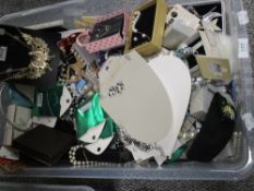 A large collection of modern costume jewellery, many items new with packaging, including beads and