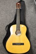 A Seville three quarter size guitar with case