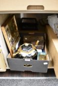 A framed collection of embroidered badges, black and gilt teapot and stand, a retractable