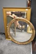 Two gilt framed wall mirrors.