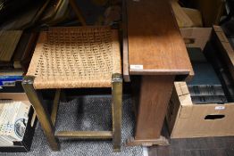 A vintage art deco style drop leaf coffee table and a woven seated stool.