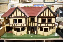 A large dolls house 120cm x 60cm x 43cm approx.
