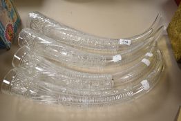 Four antique cut glass horn shaped vessels, having etched detail, possibly formally part of an