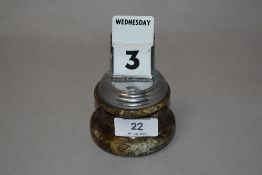 A 1930s desk top calendar, having green marble base.