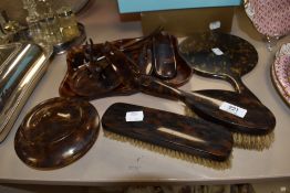 A 1940s/50s faux tortoiseshell dressing table set and other similar items, to include two