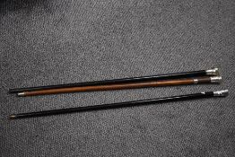 A group of three late 19th/early 20th silver topped walking canes, each of traditional design and
