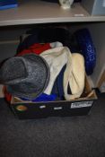 A box of ladies and gentleman's outdoor hats and other garments