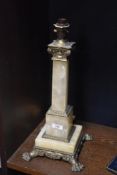 A Victorian onyx and brass electrified table lamp, the Corinthian column on a square stepped base