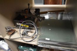A crate of metalware, chrome ceiling light mounts, and glass shelves