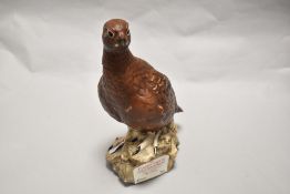 A Royal Doulton Famous Grouse Liquor bottle.