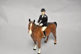 A Beswick figure study Huntswoman On Brown Horse Style 2 HN 1730