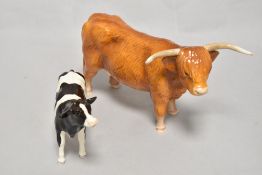 A john Beswick Highland Cow figure study JBF 75 with a Fresian Holstein calf.