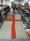A Royal Navy White Ensign/Battle Flag, rope attached, no marking seen, 165cm x 365cm