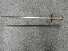 A French Gras Rifle model 1874 Bayonet in script 1879 with metal scabbard, blade length 52cm,