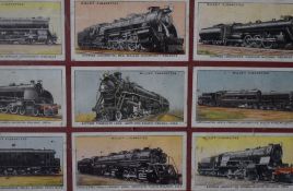 An assorted collection of framed cigarette cards, comprising Player's regiments, coats of arms,