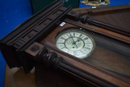 A 19th Century mahogany Vienna style walled clock, the enamelled dial named for J Bowley,