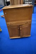 A vintage golden oak Ercol style bureau by Priory