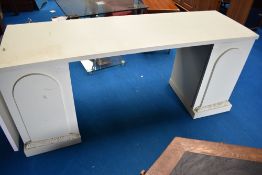 A modern pedestal console table.