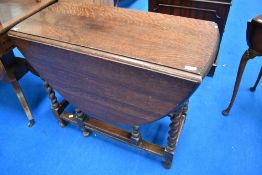A 1940's barley-twist oak gate-legged table, of traditional form 74cm x 87cm