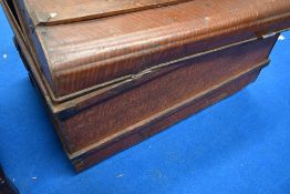 A vintage tin travel trunk having scumble effect finish